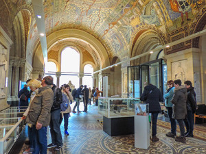 People looking at exhibits in a museum