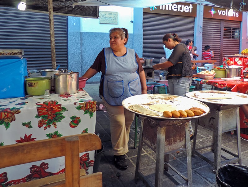 a group of food vendors - things to do in Oaxaca