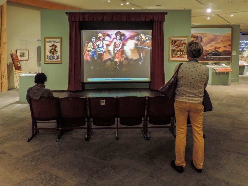 woman looking at an exhibit - things to do in Cody WY