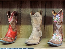 colorful cowgirl boots on a shop shelf