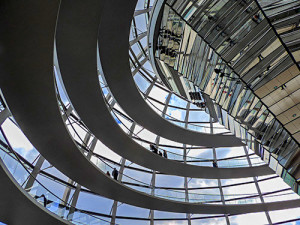 people walking on ramps inside a huge glass dome