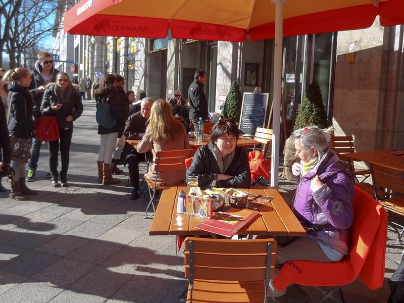 people sitting at an outdoor café