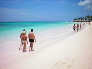 people walking along a beach