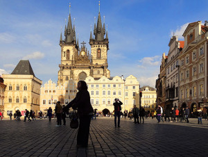 people in front of an old church on a square