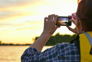 man taking photo with his phone