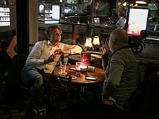 2 men at a table in a restaurant