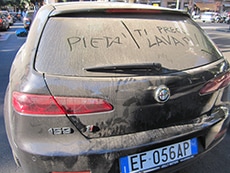 a car covered with dust
