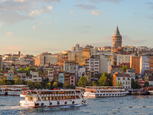 a ferryboat going by a city