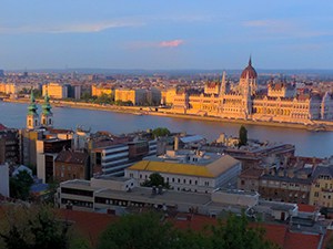 sunset on Hugnarian Parliament, seen on a river cruise in Eastern Europe