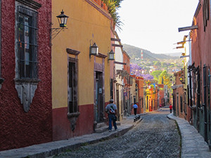 a street with colonial buildings in early morning