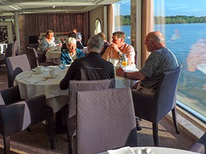 people sitting around a table talking