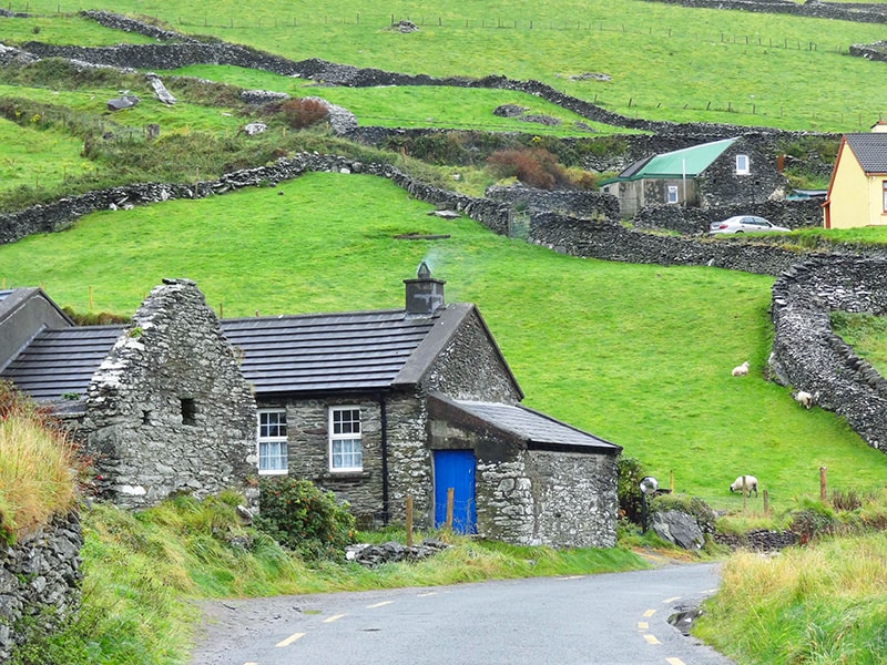 old stone houses and pastures with sheep