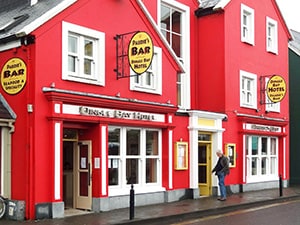 a red painted hotel on the on the Dingle peninsula in Ireland