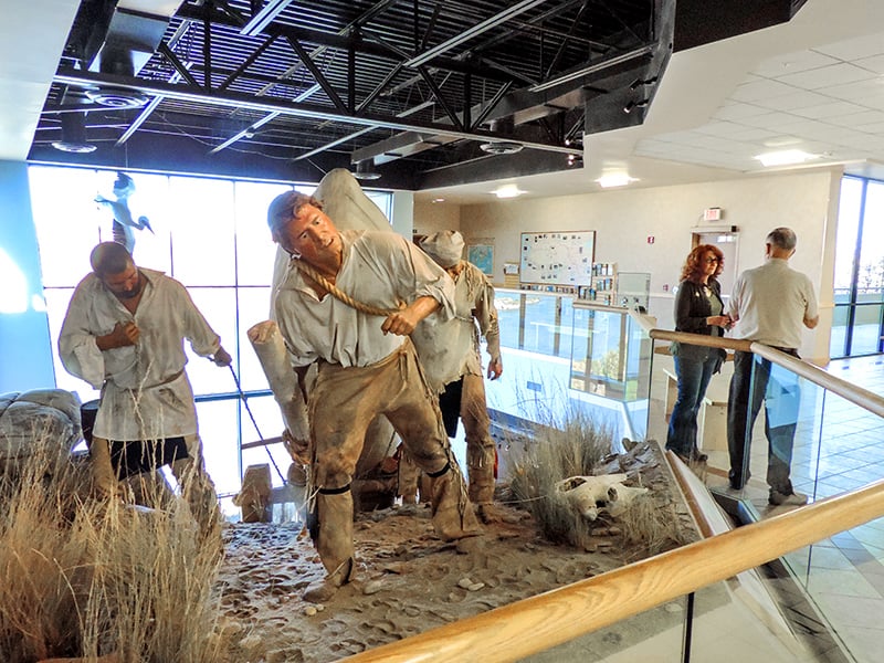 diorama of men pulling a load with ropes, seen at the Lewis and Clark Interpretive Center