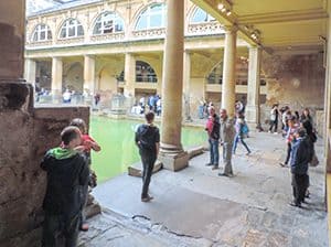 people at the Roman baths seen on a day trip from London to Bath