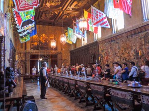 people and flags in an large ornate room