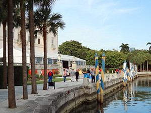 people walking along a seawall