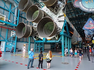 people looking at a rocket engine