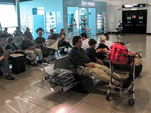 people sitting in an airport lounge