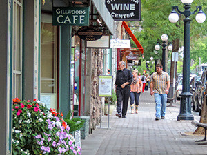 people walking by shops