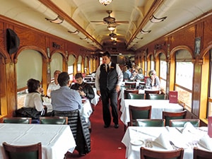 people in a train dining car