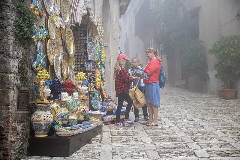 people shopping at an outdoor market