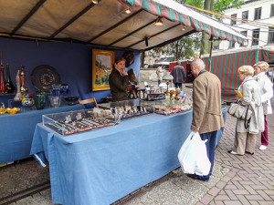 man looking at antiques
