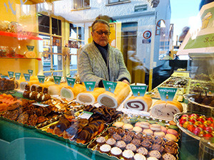 man in a candy store Bruges, Belgium