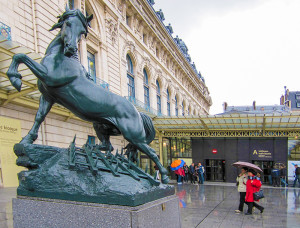 people by a statue of a horse