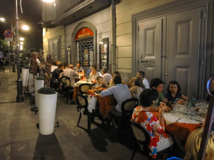 people eating at an outdoor restaurant on a European trip