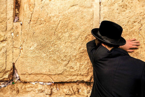 man at wall in Jerusalem