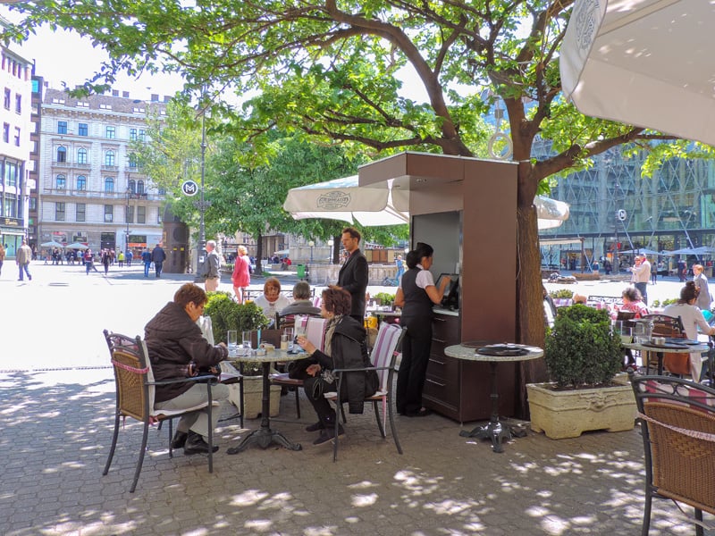 people in an outdoor cafe