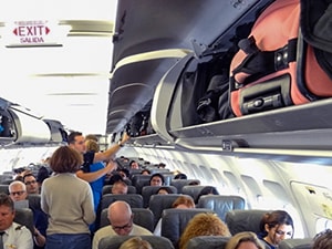 people on a crowded plane