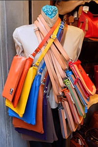 leather bags on a rack in Florence