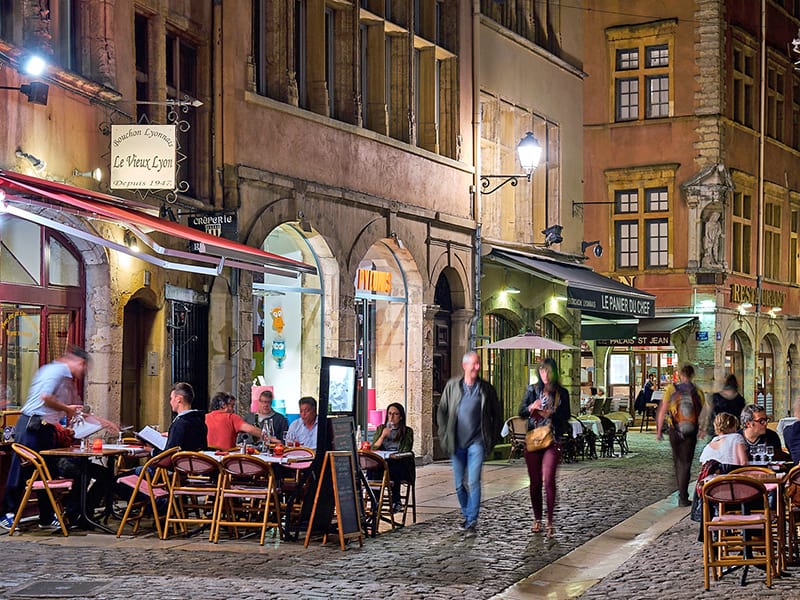 People a=t an otodoor café in Lyon, one of the places to visit in France