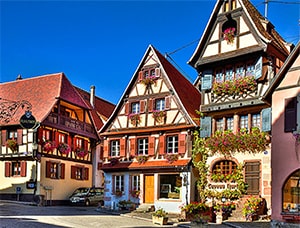 wood-timbered buildings with flower boxes in Alsace