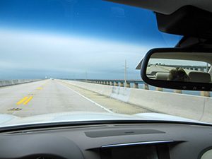 a rental car on a long bridge