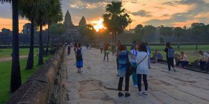 people looking at a sunrise in Angkor