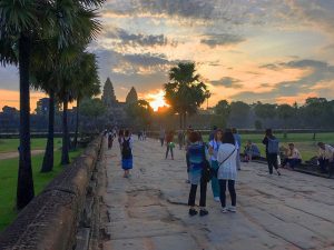 people looking at a sunrise in Angkor