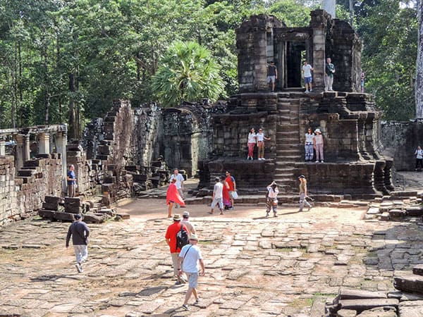people at an old ruin in Angkor Thom, Cambodia