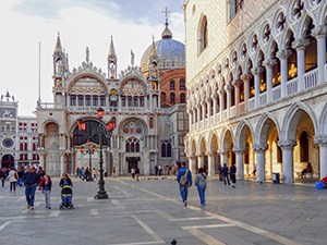 people walking a large piazzia in one of the best places to visit in Venice
