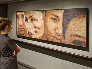 woman looking at artwork on the Konigsdam