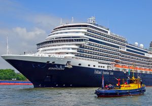 a tugboat and ship on the Konigsdam 