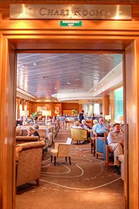 people in a lounge on the Cunard QM2