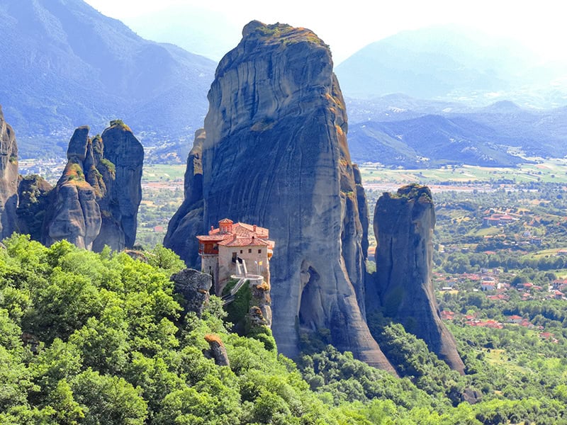 a monastery on a rocky pinnacle