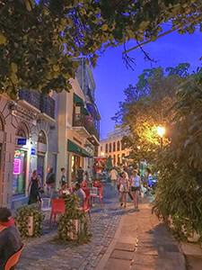 people in outdoor cafes in the evening - one of the things to do in Old San Juan