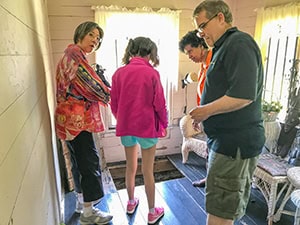 people looking at a trap door - things to do inMemphis