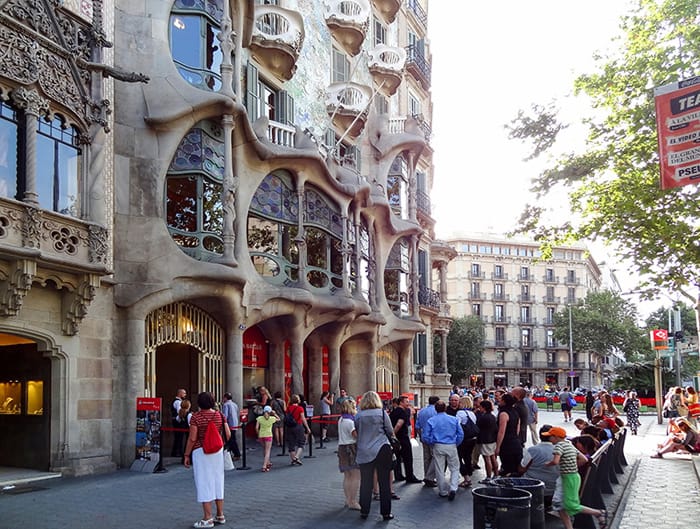 people outside an ornate building