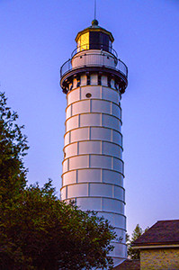 a lighthouse at sunset