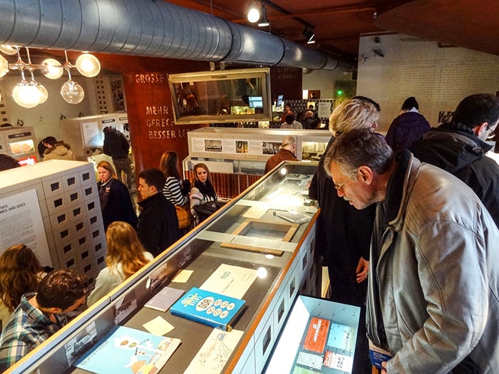 people looking at exhibits in the DDR Museum, one ofThe Best Things To Do In Berlin, Germany